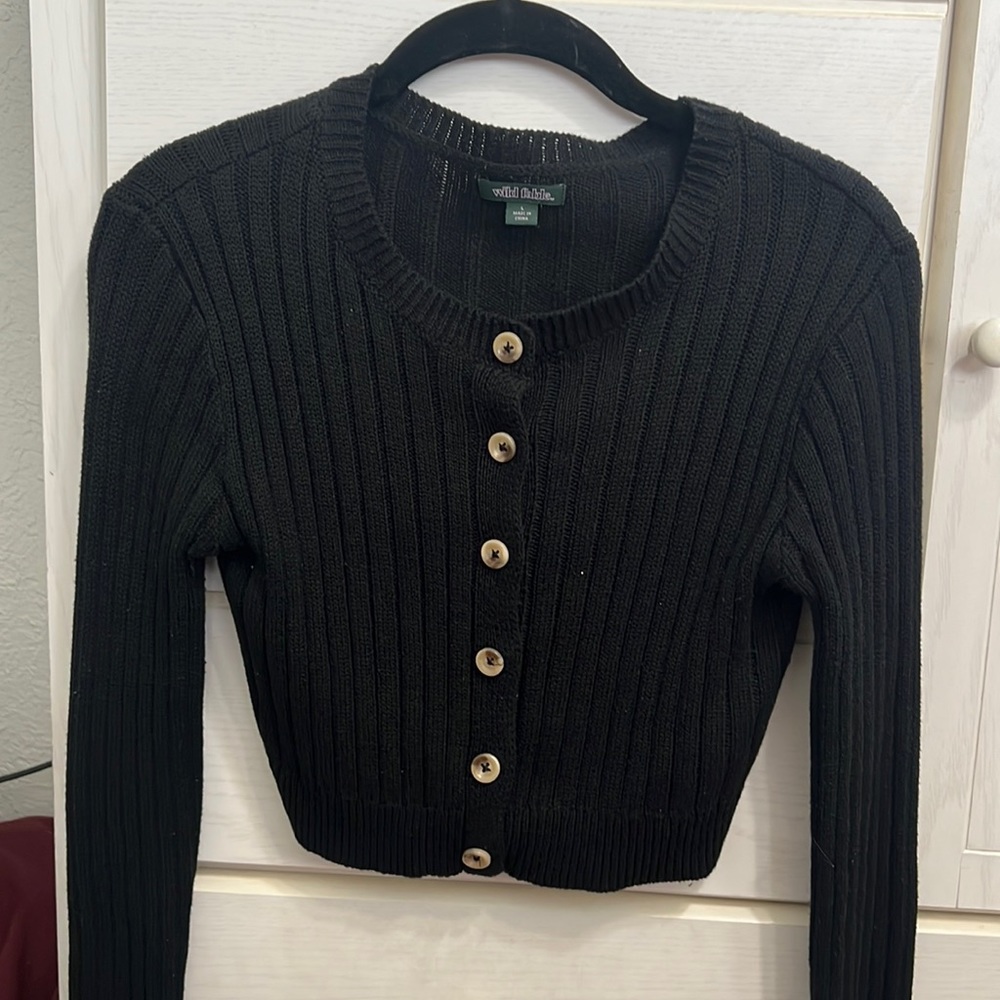 Black cropped button down sweater top.